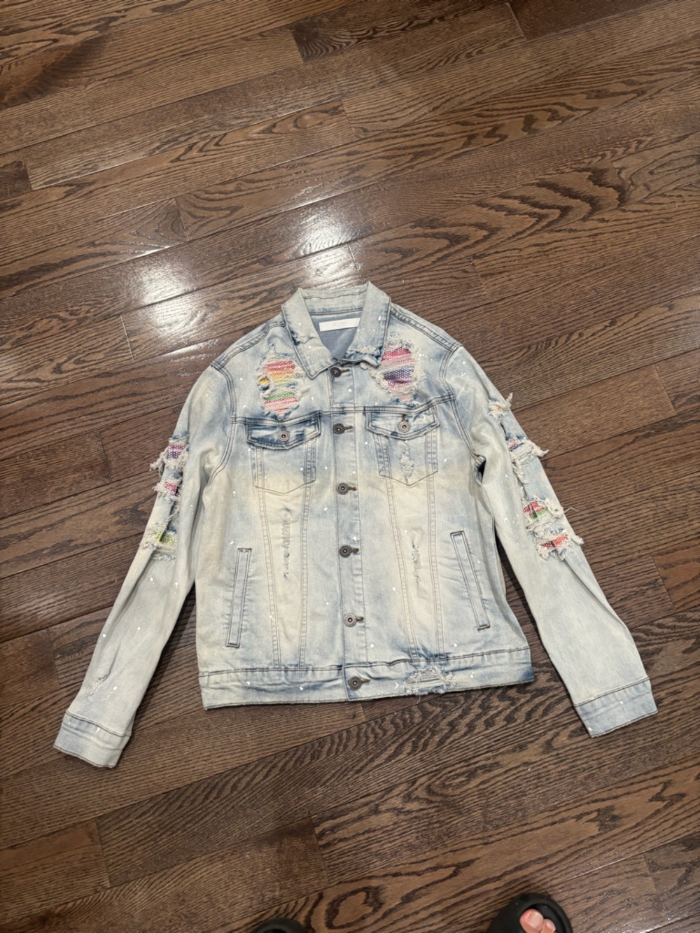 Light Wash Distressed Denim Jacket with Multicolor Patch Accents